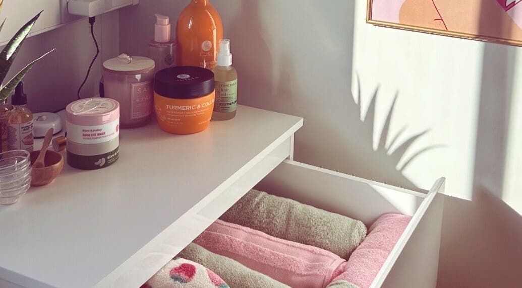 Vibes Head Spa in Birkenhead, England: A calming display of beauty products and towels in natural light.