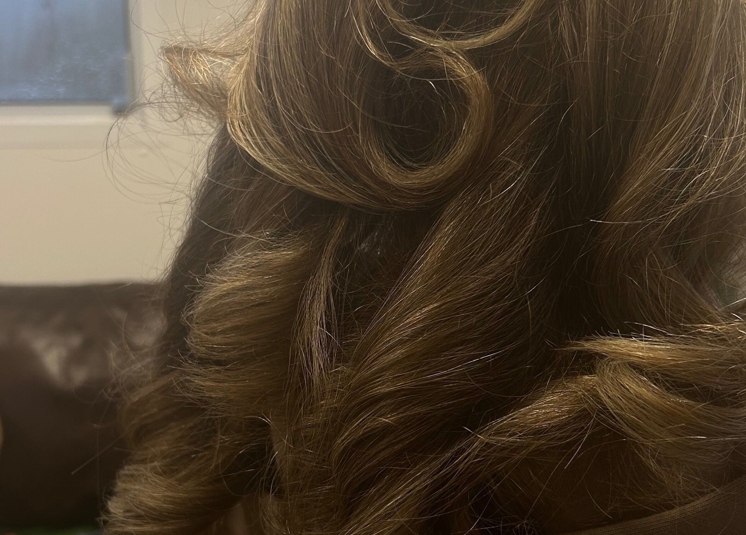 Close-up of styled curls at Vibes Head Spa, Birkenhead, England, GB, showcasing luxurious hair treatment.