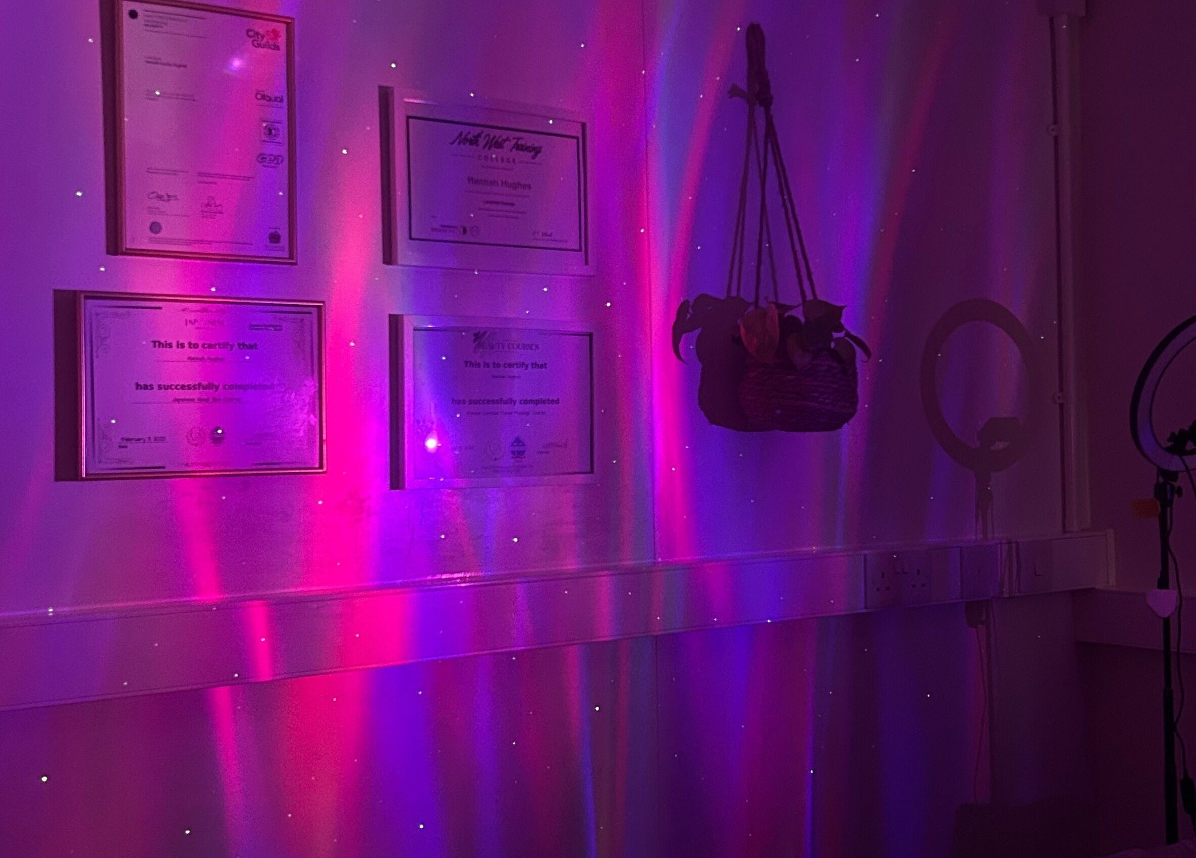 Calming purple ambiance at Vibes Head Spa, Birkenhead, England, GB showcasing certificates and decor.