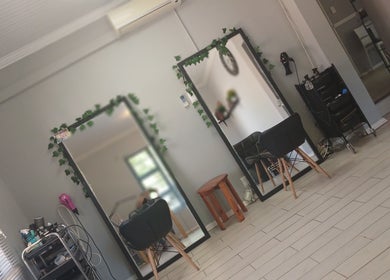 Modern salon interior at Hannelie_Diamonddol studio in Bloemfontein, Free State, ZA featuring stylish mirrors.