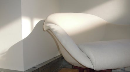 Elegant white sofa at The Haye Studio, London, England, GB, in calming natural light.