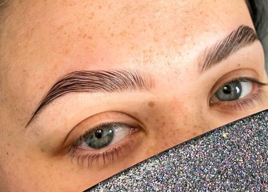 Beautifully groomed eyebrows at Twin Flame Beauty Room, East Kilbride, Scotland, GB showcasing expert styling.
