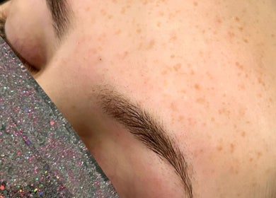 Precision eyebrow shaping at Twin Flame Beauty Room in East Kilbride, Scotland, GB.