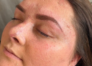 Close-up of a woman's face after eyebrow treatment at Twin Flame Beauty Room, East Kilbride, Scotland, GB.