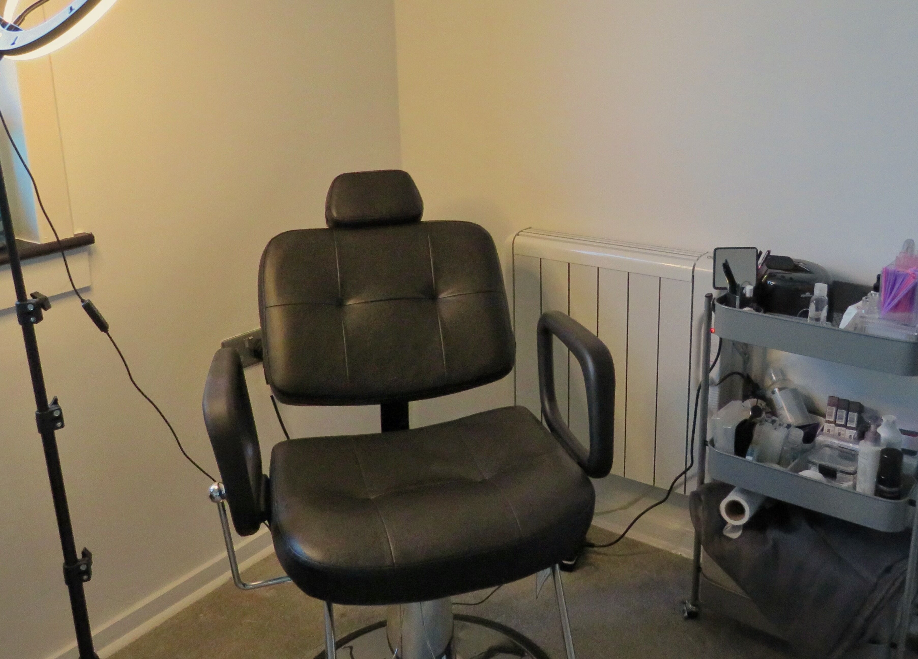 Modern treatment chair and equipment at Twin Flame Beauty Room in East Kilbride, Scotland, GB.