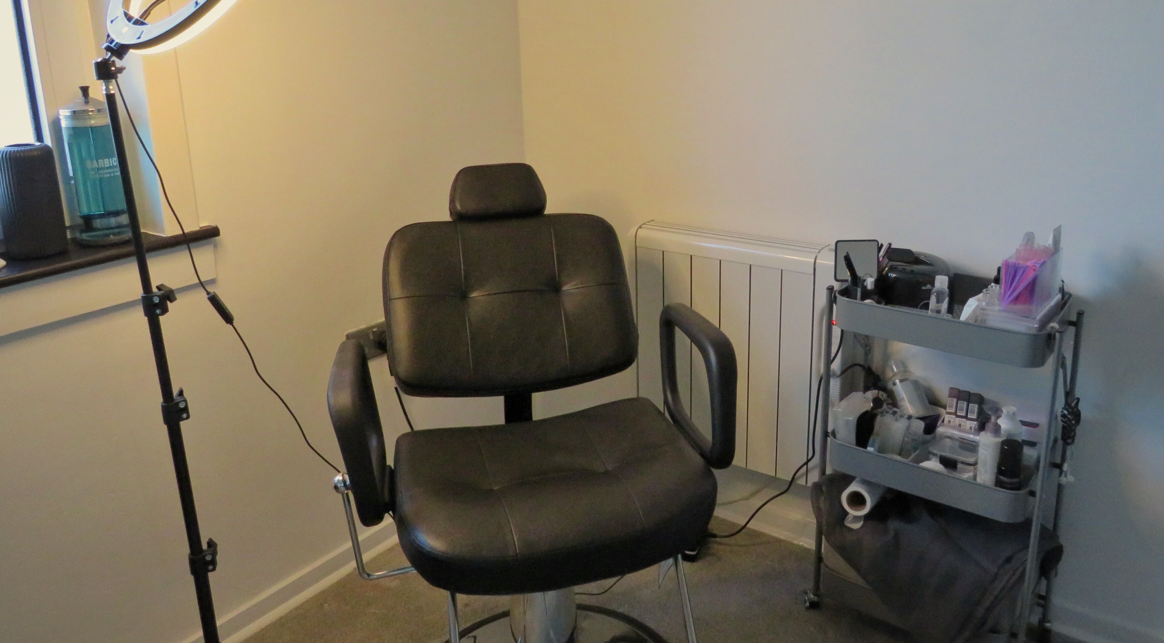 Modern treatment chair and equipment at Twin Flame Beauty Room in East Kilbride, Scotland, GB.