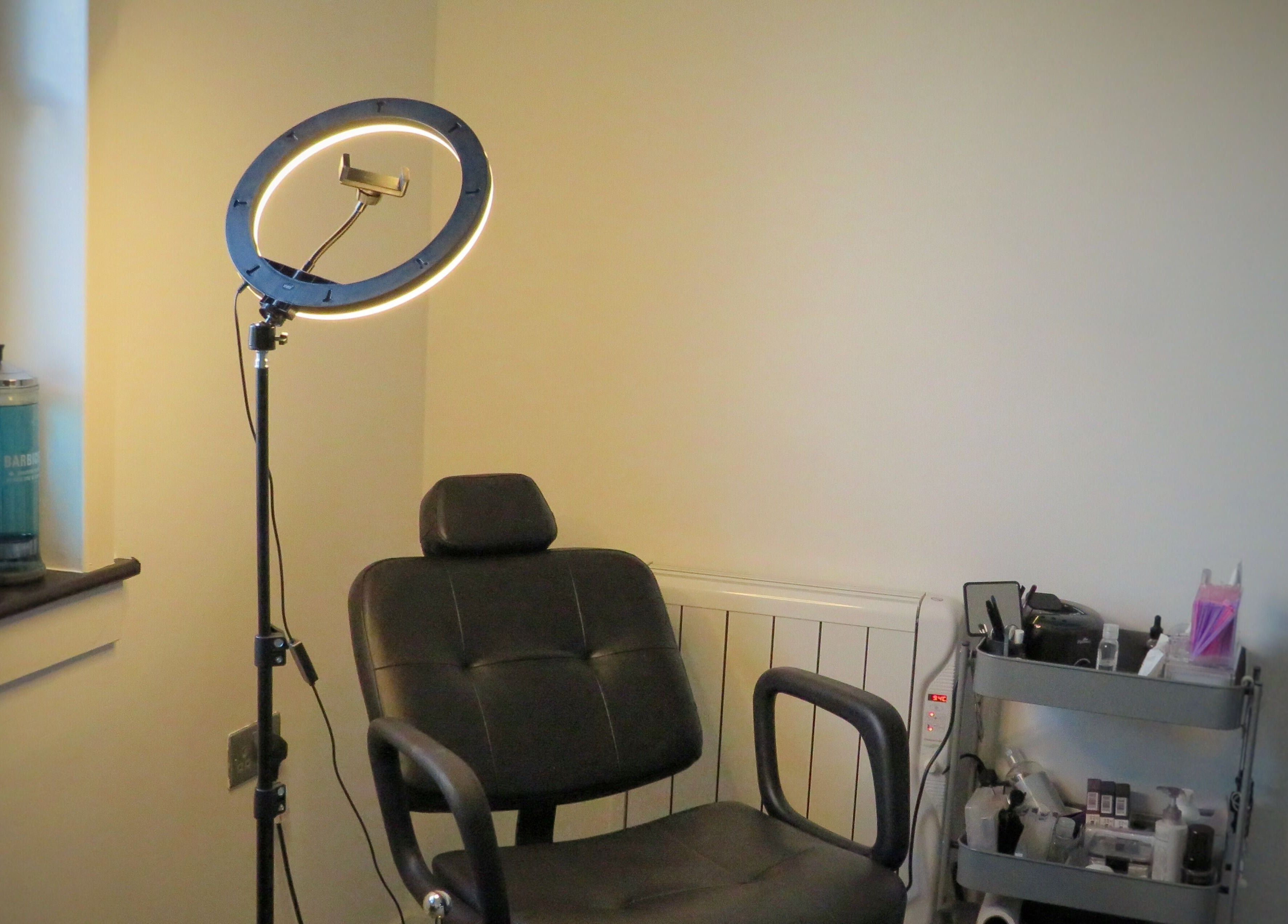 Relaxing beauty space at Twin Flame Beauty Room in East Kilbride, Scotland, GB with adjustable chair and equipment.