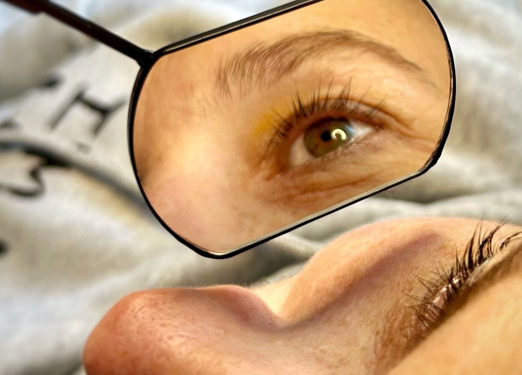 Close-up of lash treatment at Twin Flame Beauty Room, East Kilbride, Scotland, GB, featuring an eye in a mirror.