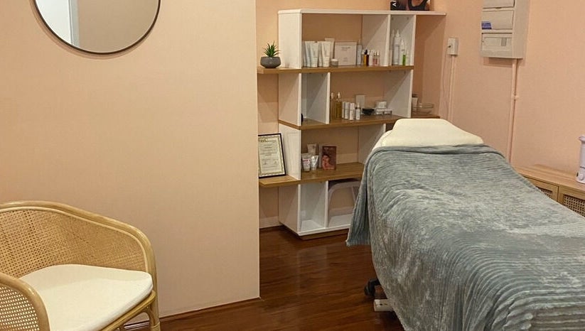 Relaxing treatment room at Classique Beauty and Skin, Ellenbrook, Western Australia, AU, with a plush bed and serene decor.