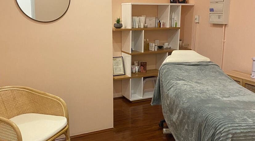 Relaxing treatment room at Classique Beauty and Skin, Ellenbrook, Western Australia, AU, with a plush bed and serene decor.