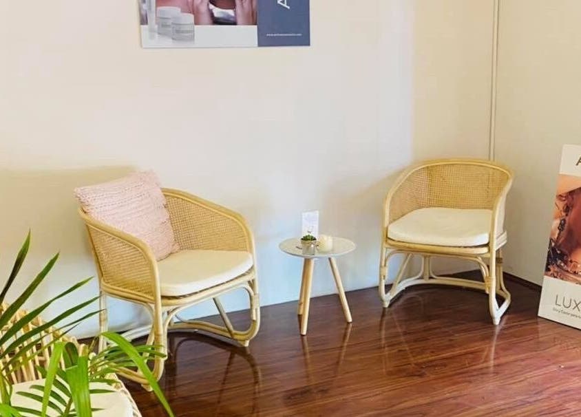 Cozy seating area with rattan chairs at Classique Beauty and Skin, Ellenbrook, Western Australia, AU.