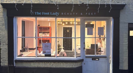 Front view of Hello May Beauty in Ottery Saint Mary, England, GB showcasing inviting interior lighting.