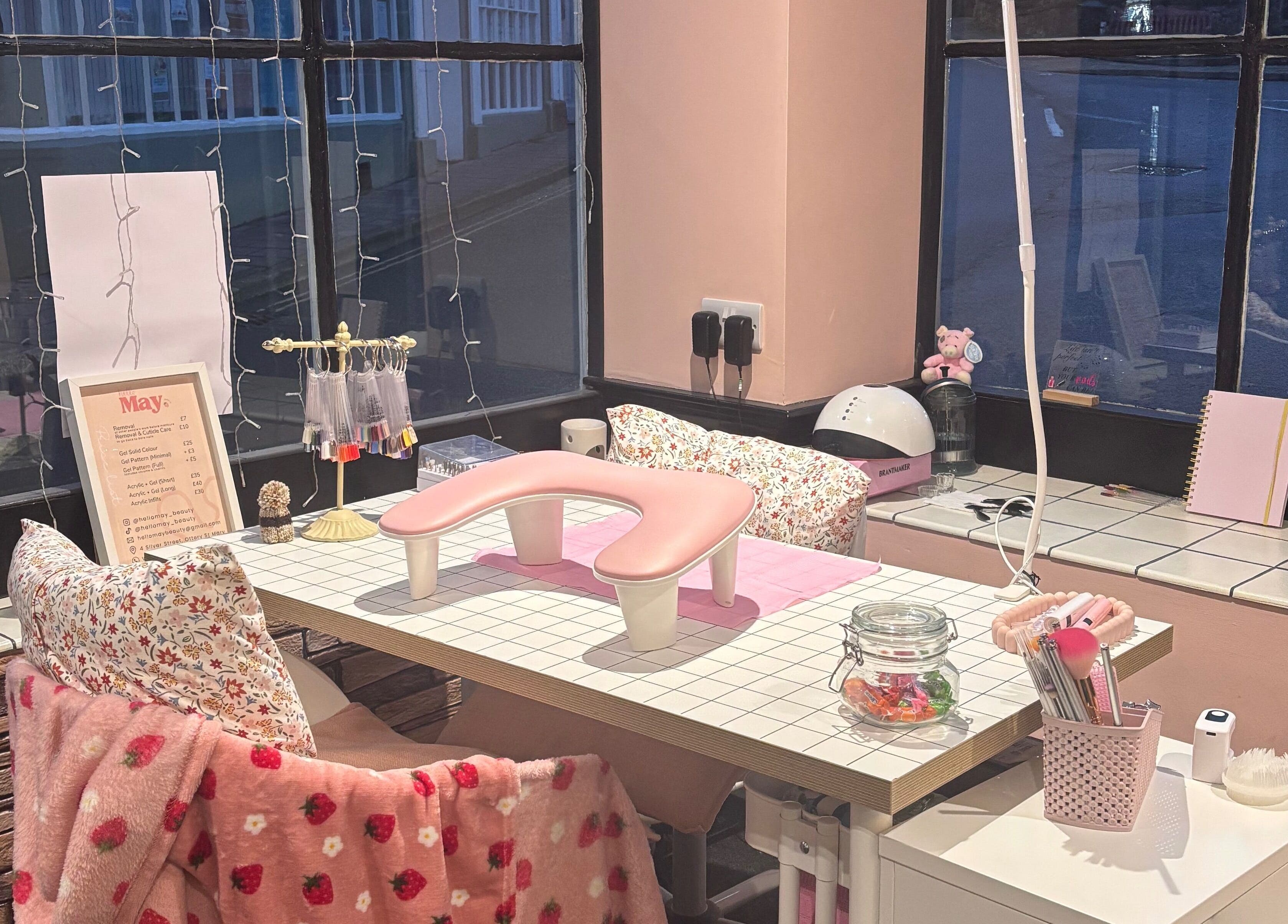Cozy nail station at Hello May Beauty, Ottery Saint Mary, England, GB, with elegant pink decor.