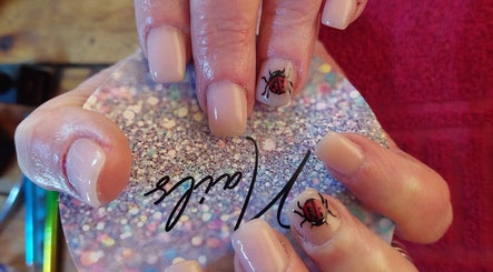 Close-up of ladybug nail art at Chella's Beauty and Photography, Emalahleni, Mpumalanga, ZA.