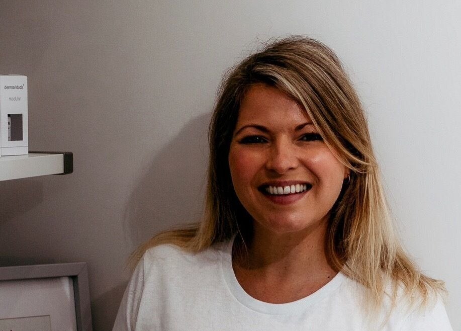 Friendly staff member at The Surrey Skin Clinic, Oxted, England, GB, showcasing welcoming atmosphere.