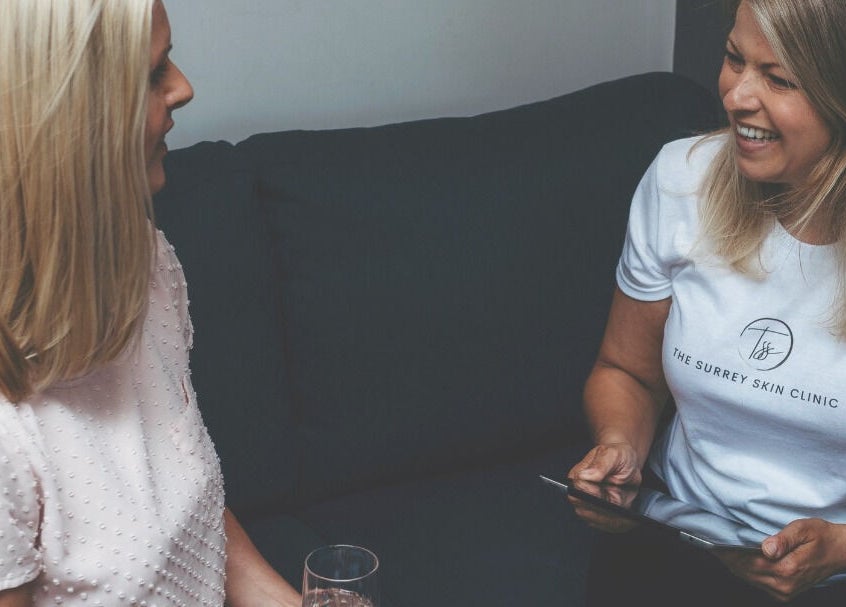 Consultation at The Surrey Skin Clinic, Oxted, England, GB with staff member engaging with a client.