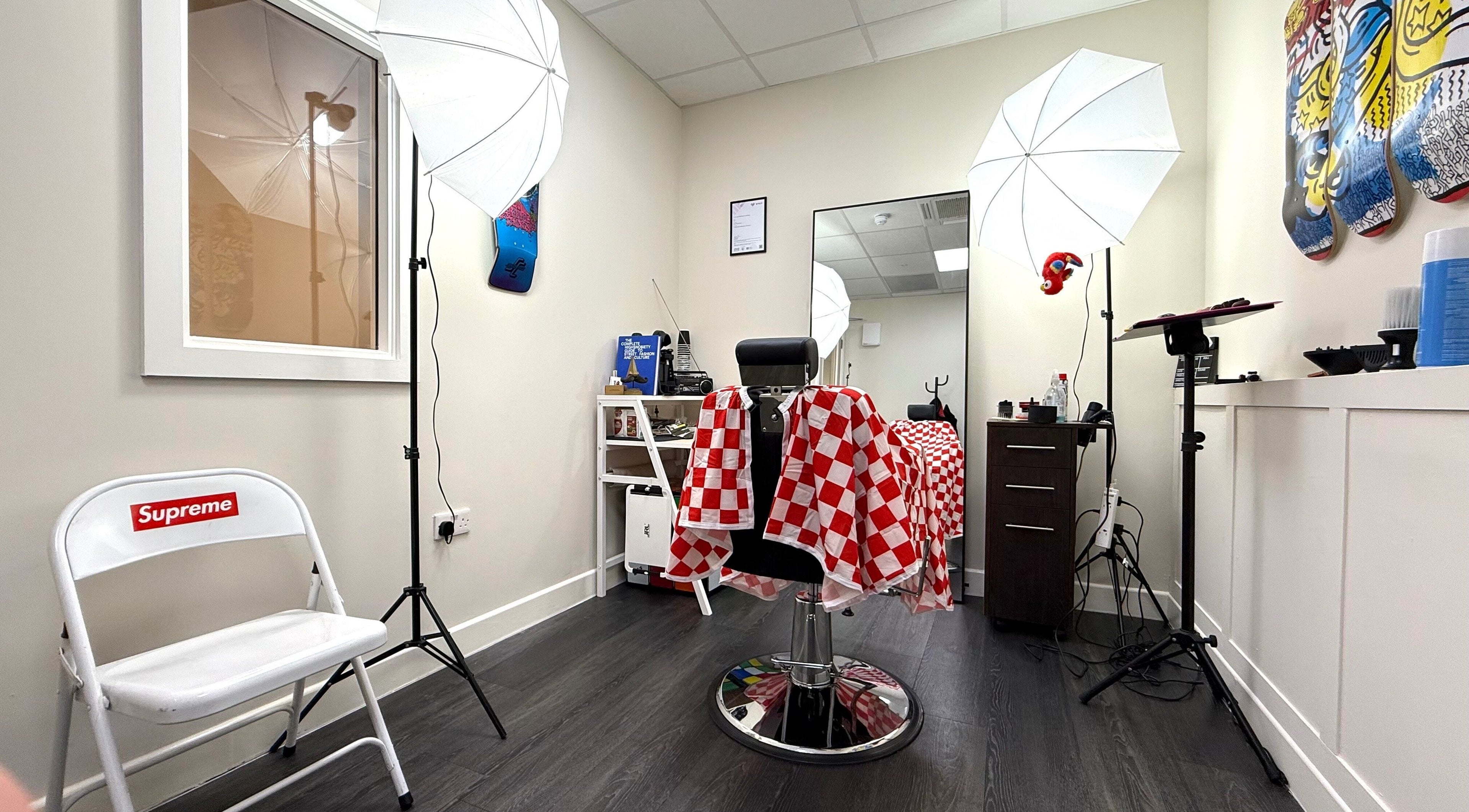 Interior of Sharps The Barber - SC Studio 105 in Manchester, England, GB showcasing a modern barbershop setup.