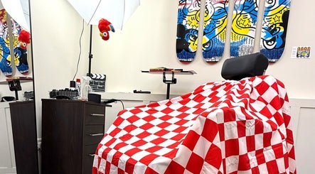 Colorful barber chair and decor at Sharps The Barber - SC Studio 105, Manchester, England, GB.