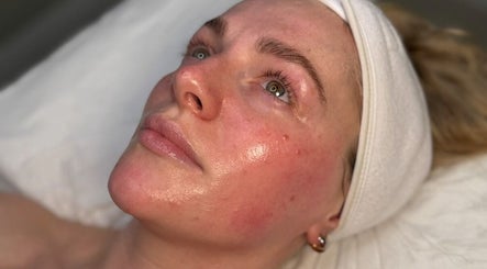 Client experiencing a revitalizing facial at NISHA SKNN Aesthetics & Skin, Liverpool, England, GB.