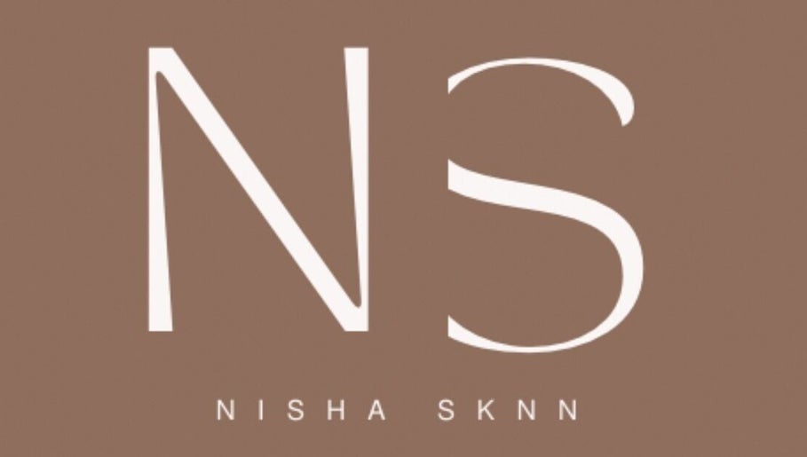NISHA SKNN Aesthetics & Skin logo set against a brown background in Liverpool, England, GB.