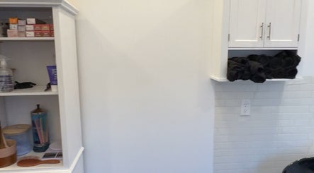 Shelves with beauty products at Laur’s Glam Files in Brantford, Ontario, CA showcasing elegant organization.