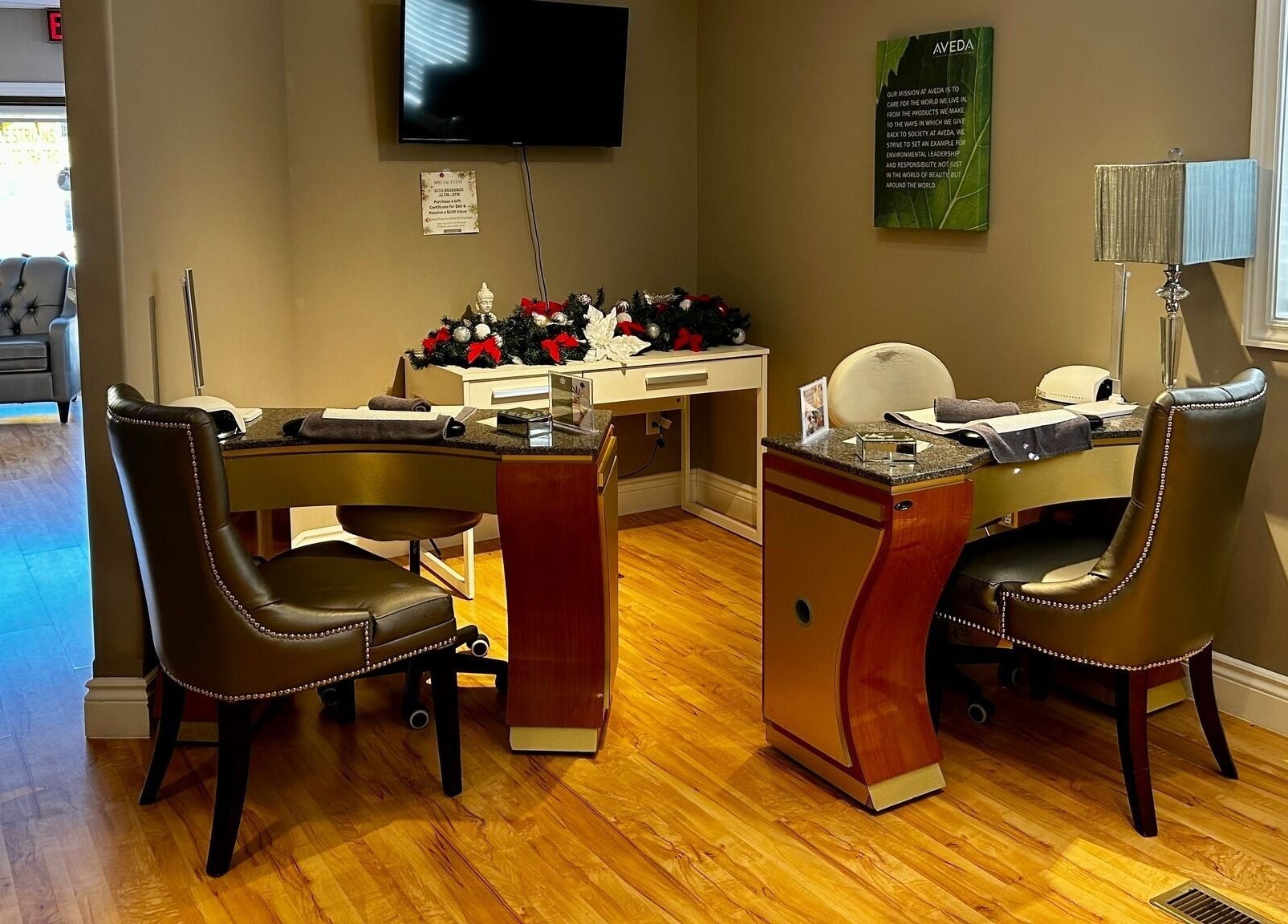 Manicure station at Panache Spa & Academy, Midland, Ontario, CA with plush seating and stylish decor.