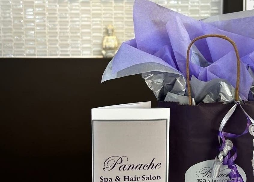 Gift bag and brochure at Panache Spa & Academy in Midland, Ontario, CA, showcasing spa offerings.