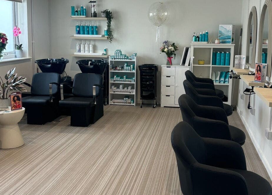 Modern interior of Summer Rose Hairdressing in East Goscote, England, GB featuring stylish seating and decor.