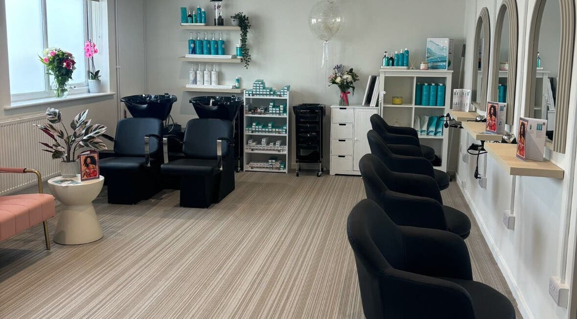 Modern interior of Summer Rose Hairdressing in East Goscote, England, GB featuring stylish seating and decor.