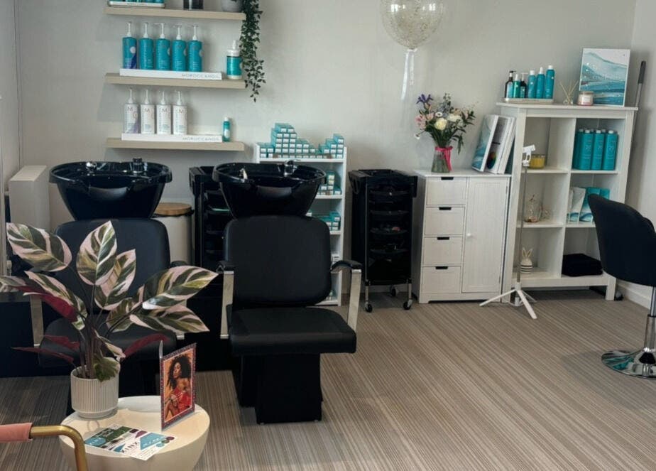 Stylish salon at Summer Rose Hairdressing, East Goscote, England, GB. Modern chairs, beauty products, and decor.