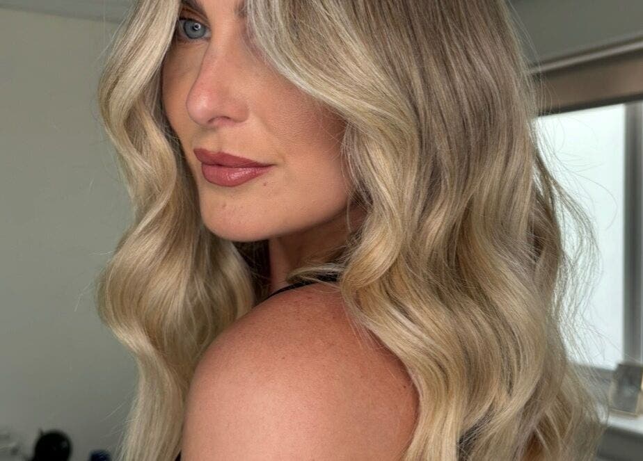 Elegant blonde waves styled at Summer Rose Hairdressing, East Goscote, England, GB.