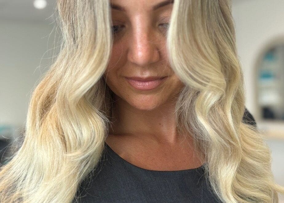 Elegant blonde waves styled at Summer Rose Hairdressing, East Goscote, England, GB.