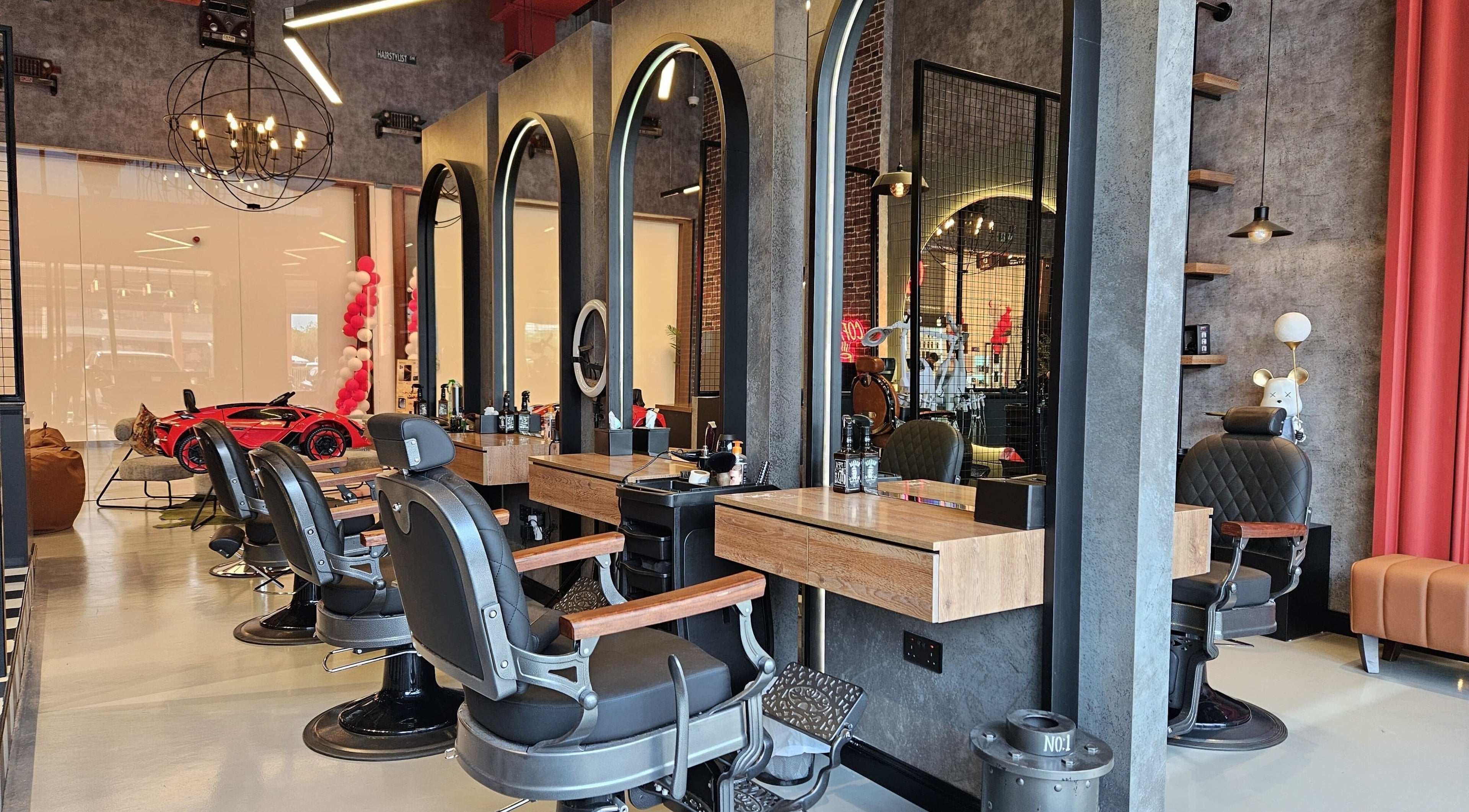 Stylish interior of Vasteras Gents Salon, Dubai, Dubai, AE with modern barber chairs and decor.