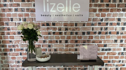 Elegant setup at Lizelle Beauty, Aesthetics & Nails in Bloemfontein, Free State, ZA features flowers and menu.
