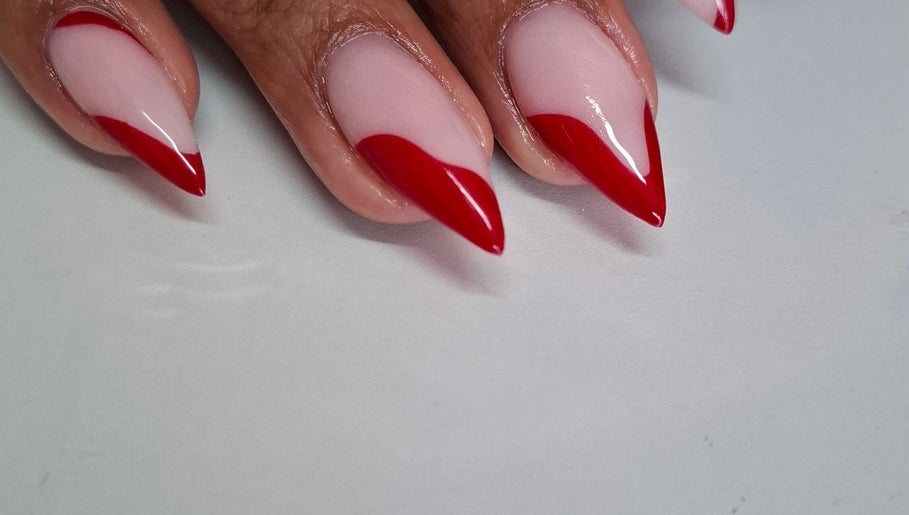 Elegant red-tipped nails from Nails by Shekeenah in Ennerdale, Gauteng, ZA, showcasing chic nail artistry.