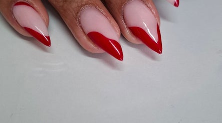Elegant red-tipped nails from Nails by Shekeenah in Ennerdale, Gauteng, ZA, showcasing chic nail artistry.