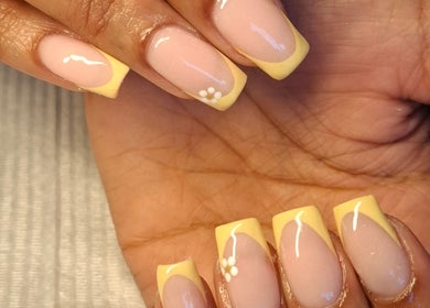 Elegant French manicure with floral detail at Nails by Shekeenah, Ennerdale, Gauteng, ZA.