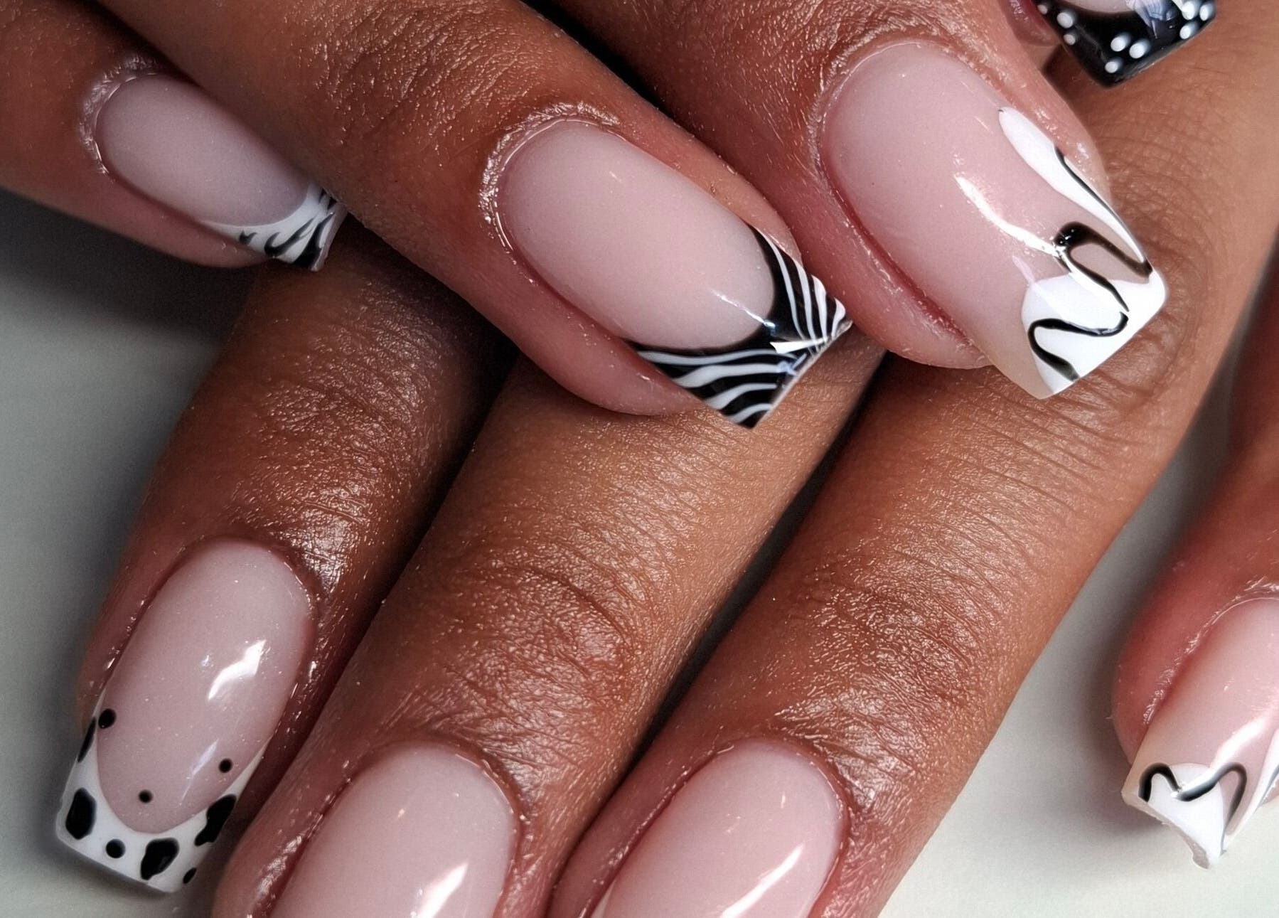 Elegant black and white nail art by Nails by Shekeenah in Ennerdale, Gauteng, ZA, showcases exquisite style.