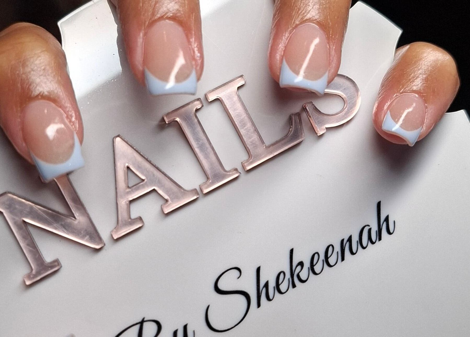Elegant French manicure at Nails by Shekeenah, Ennerdale, Gauteng, ZA, showcasing stylish nail art.