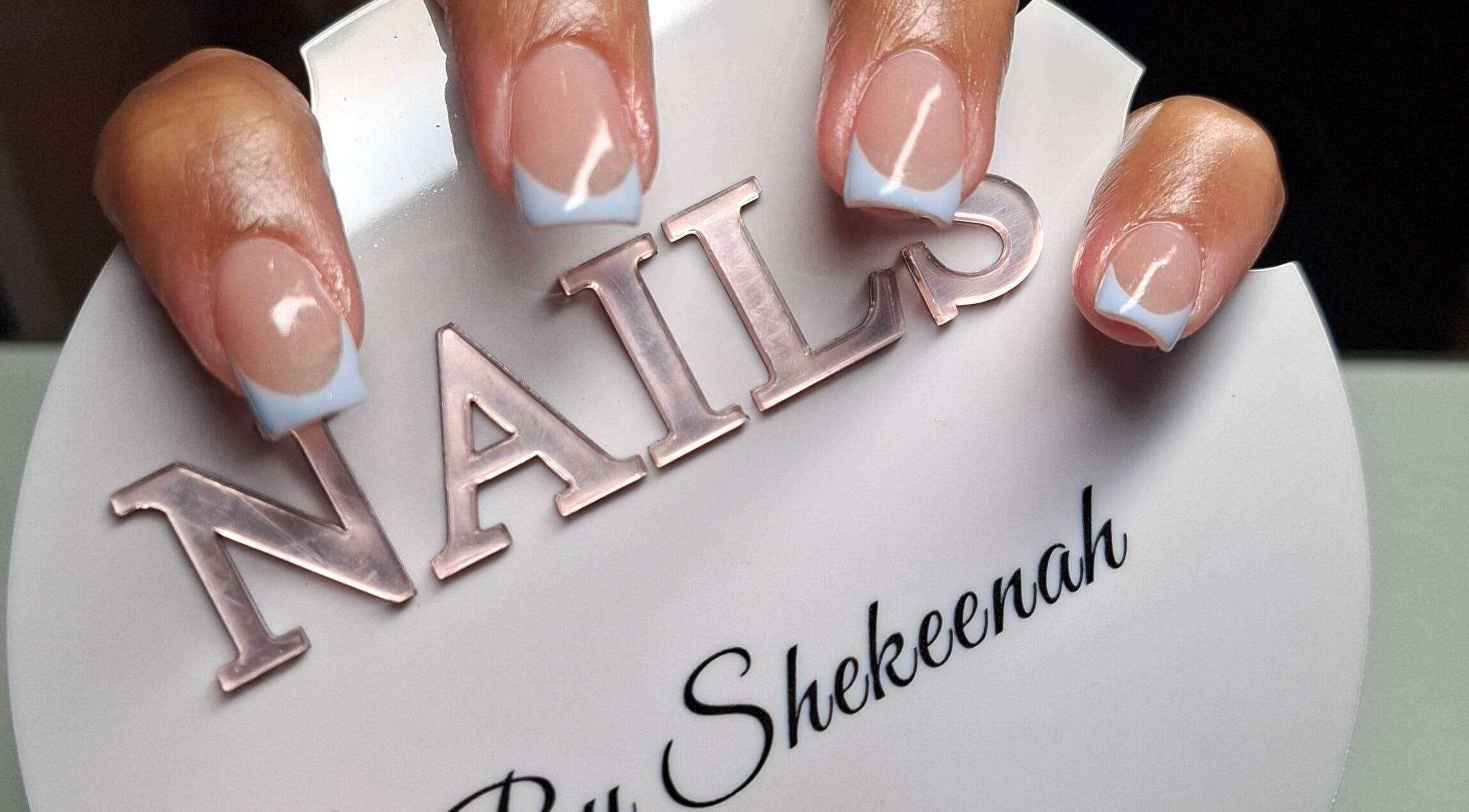 Elegant French manicure at Nails by Shekeenah, Ennerdale, Gauteng, ZA, showcasing stylish nail art.