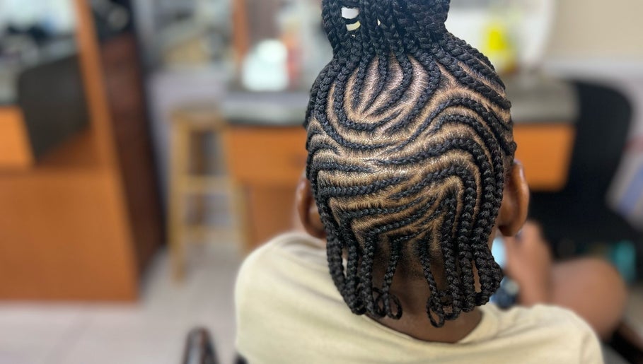 Intricate braided hairstyle at Salon D'or, expertly crafted in George Town, George Town, KY.