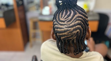 Intricate braided hairstyle at Salon D'or, expertly crafted in George Town, George Town, KY.