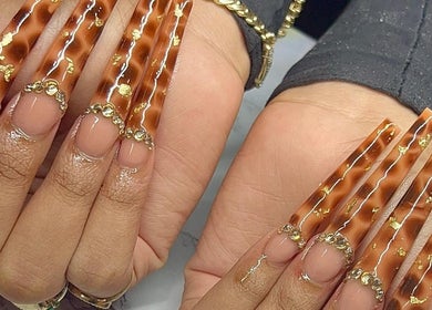 Elegant tortoise shell nails with gold accents at Salon D'or, George Town, George Town, KY.
