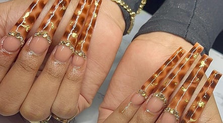 Elegant tortoise shell nails with gold accents at Salon D'or, George Town, George Town, KY.