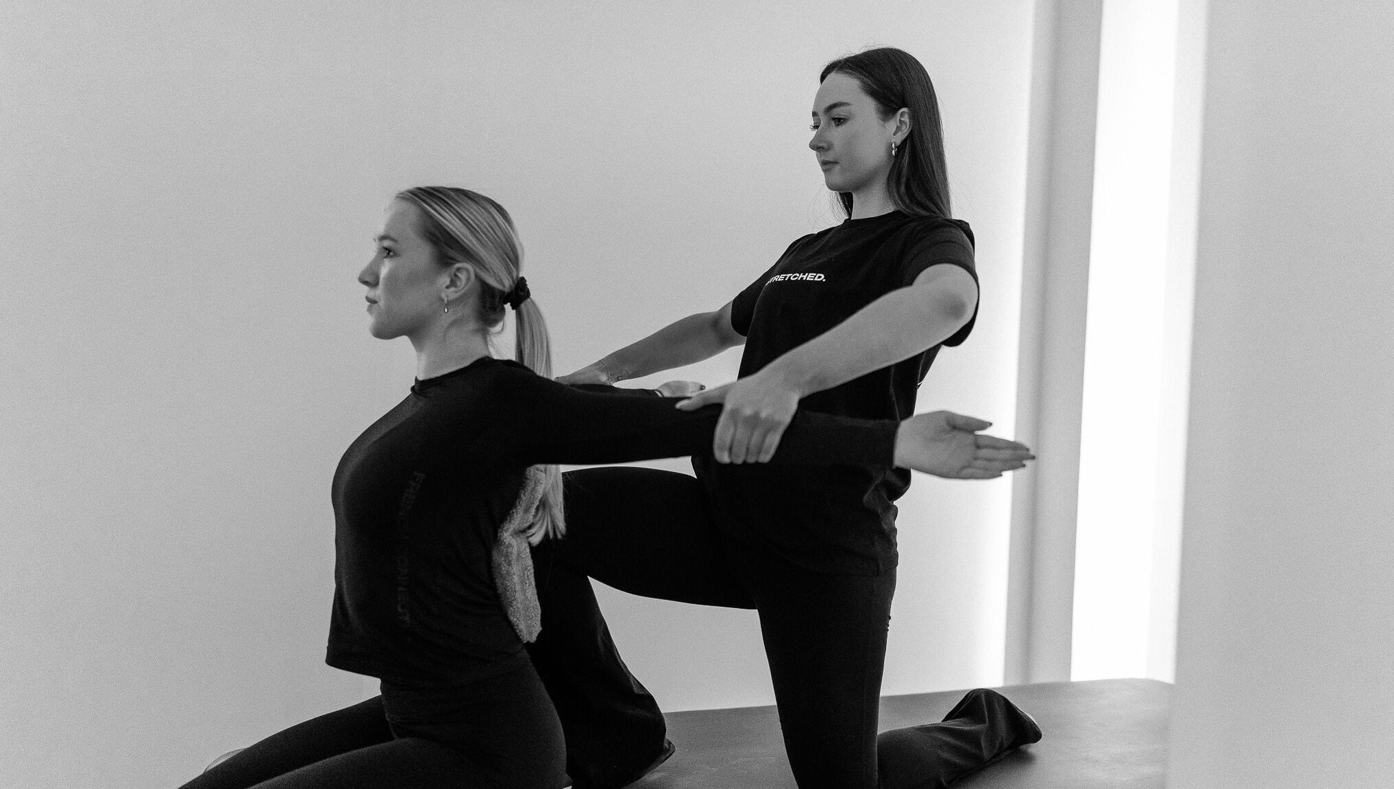 Instructor guides client in stretching at Stretched Edinburgh, Edinburgh, Scotland, GB wellness center.