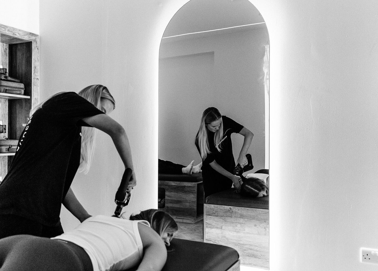Therapist giving massage at Stretched Edinburgh, Edinburgh, Scotland, GB in a serene room.