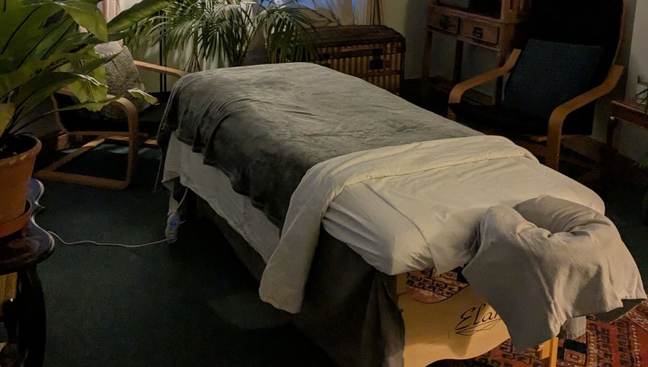 Relaxing therapy room setup at KS Holistic Therapies in Bath, England, GB with massage table and cozy decor.