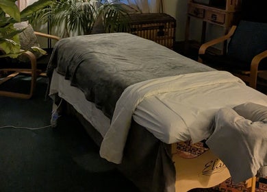 Relaxing therapy room setup at KS Holistic Therapies in Bath, England, GB with massage table and cozy decor.