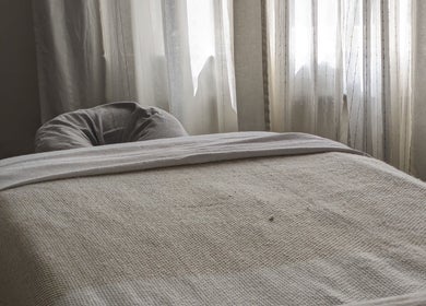 Cozy treatment room at KS Holistic Therapies, Bath, England, GB with soft natural light and a massage table.