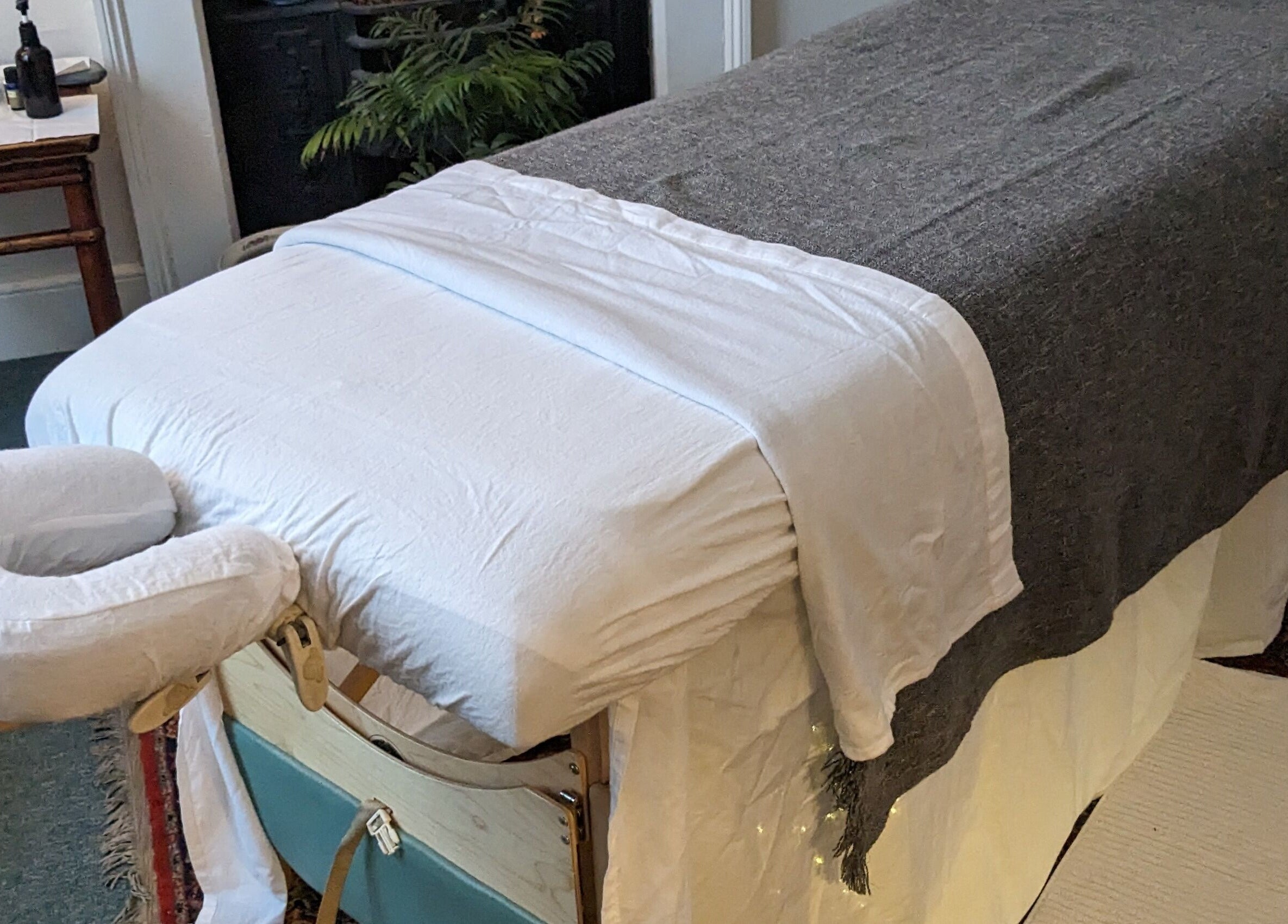Massage table at KS Holistic Therapies, Bath, England, GB, ready for wellness treatments.